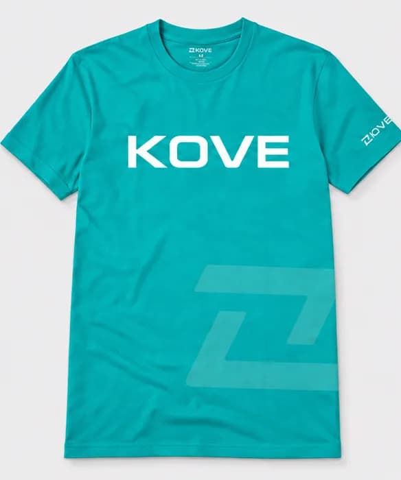 Teal short-sleeve t-shirt with “KOVE” printed large in white across the chest, the brand symbol tone-on-tone on the lower front and a small label on one sleeve